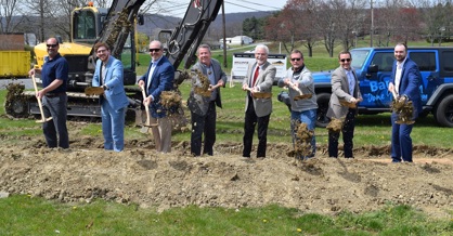 Representatives from F&M Trust, Lower Paxton Township, Campbell Commercial Partners LLC, and A.P. Williams Construction throw the first shovels of dirt at the site of a future F&M Trust community office at 4765 Linglestown Road in Harrisburg.