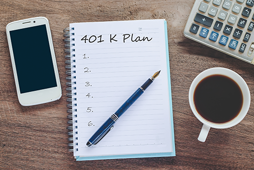notebook with 401K plan written on it